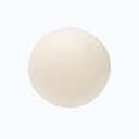 Round konjac facial sponge on a neutral 
background