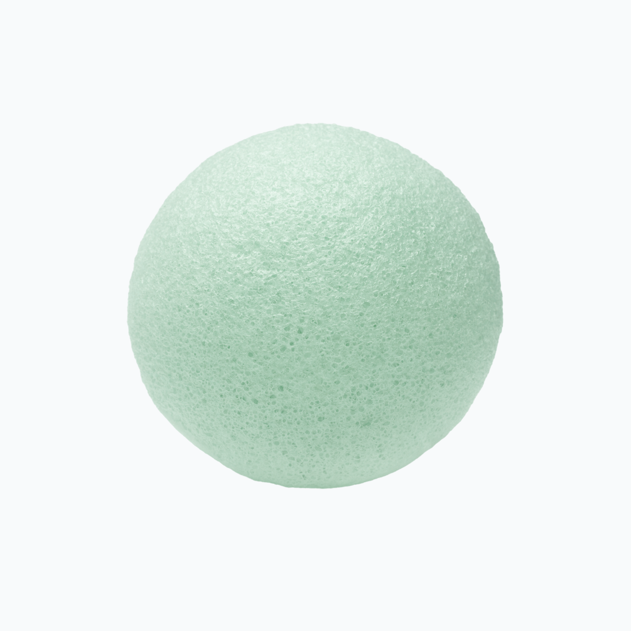 Green tea konjac sponge on a white background.