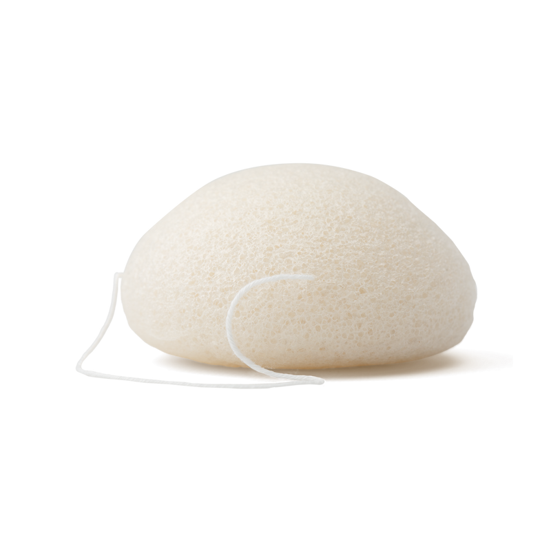 White konjac facial sponge with a string on a white background