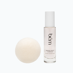 Bēm's Barrier Reset Complex serum bottle and a round facial sponge on a neutral background