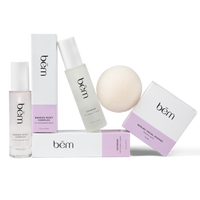 Three products and their boxes, including serum bottles and a facial sponge on a white background.