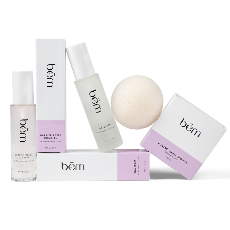 Three products and their boxes, including serum bottles and a facial sponge on a white background.