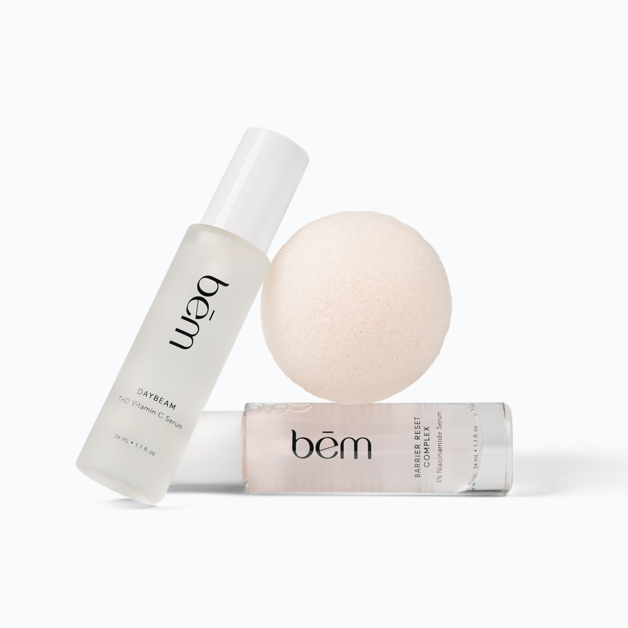 Bēm Skincare products including 2 serums and konjac facial sponge on a white background