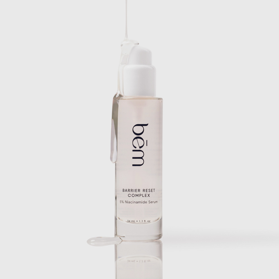 Barrier Reset Complex serum bottle with serum dripping down bottle on a light gray background