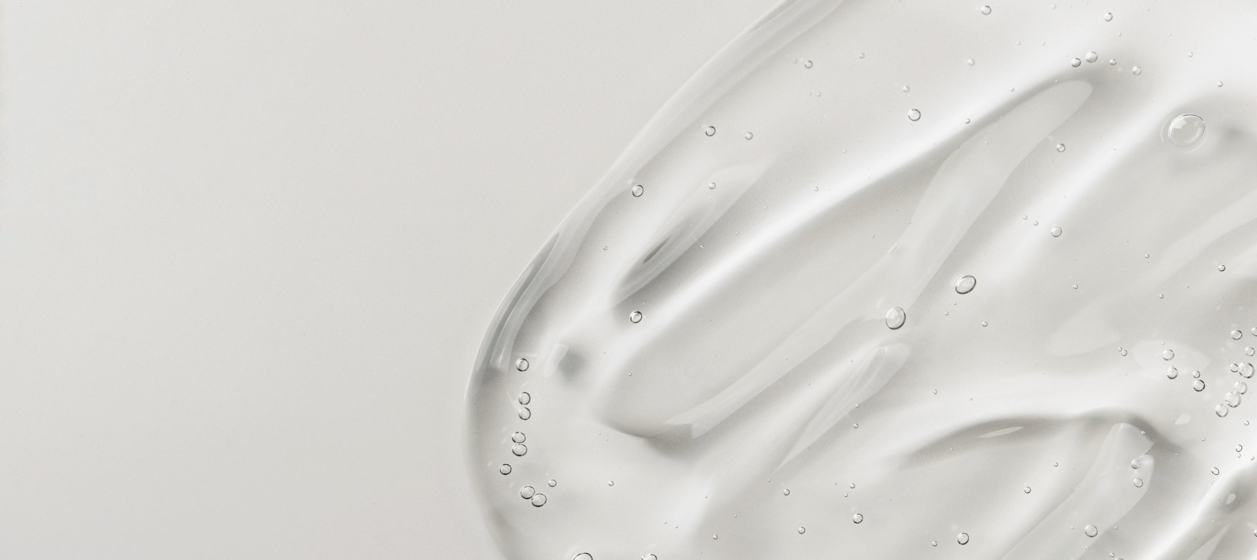 Close-up of a smooth, serum swatch with subtle texture